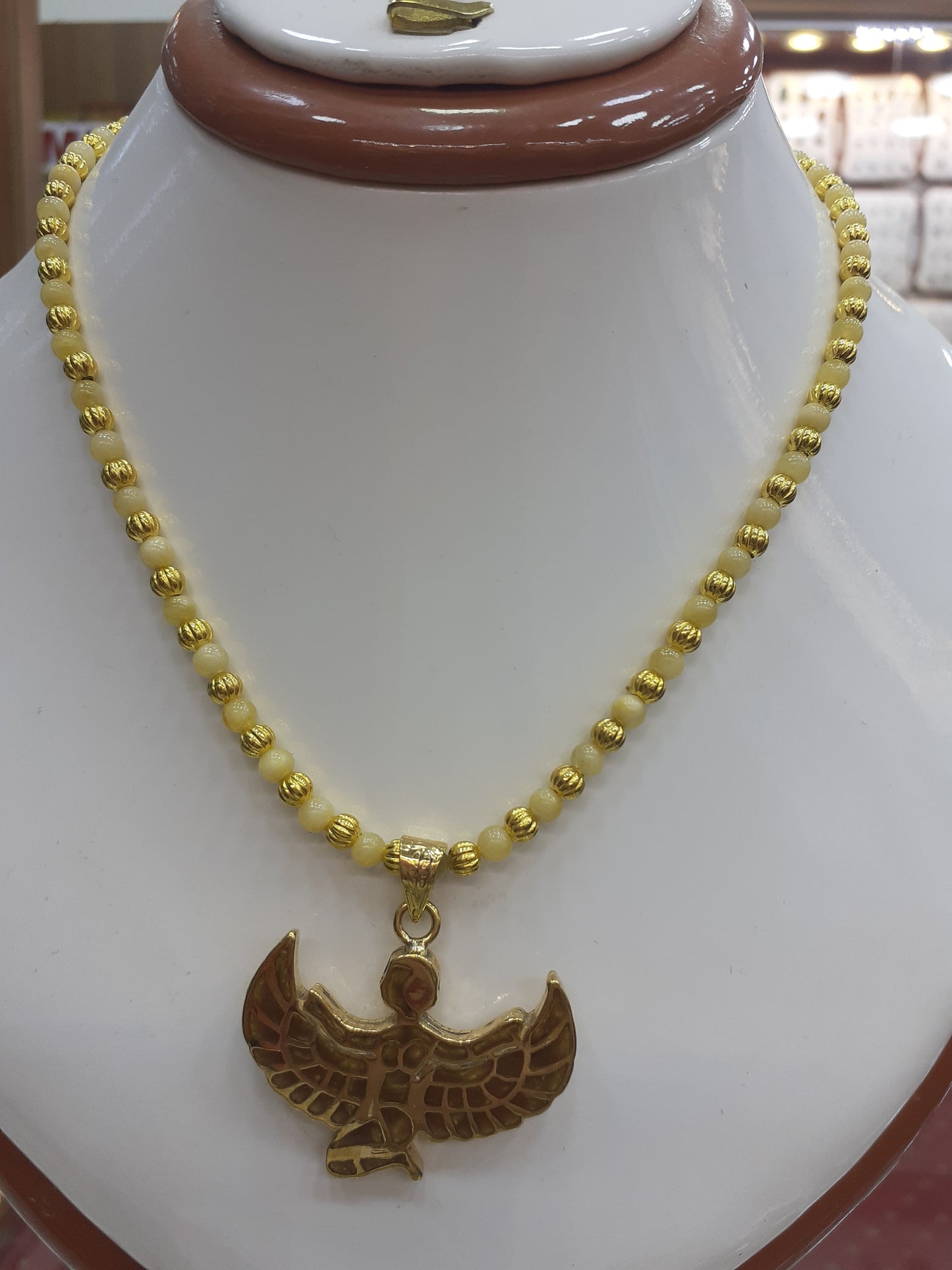 Necklace Amber beads, with goldplated pendant "Goddess Isis"