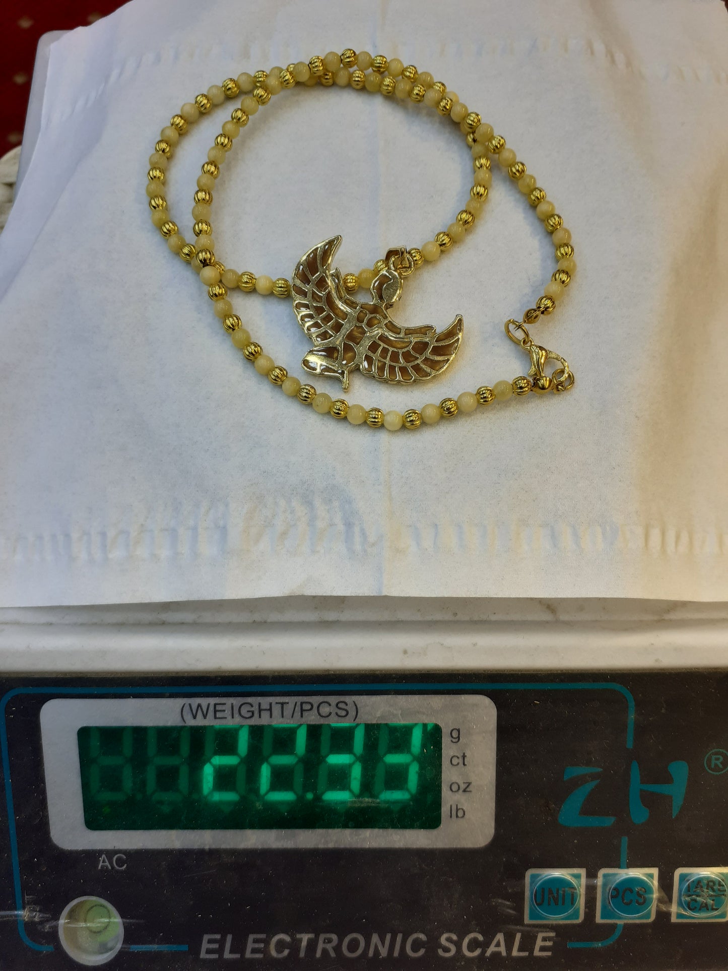Necklace Amber beads, with goldplated pendant "Goddess Isis"